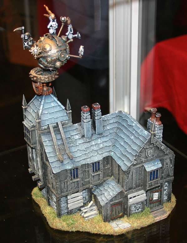 A building with some wierd undead type thing on the roof.