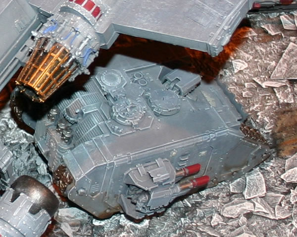 Land Raider under the wing of a Space Marine Thunderhawk Transporter. 