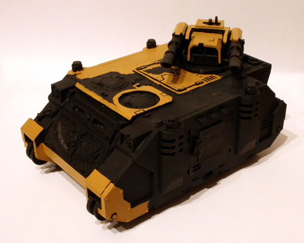 I painted more of the basecoat. For this I used the Foundation Paints from Games Workshop, specifically Tausept Ochre.