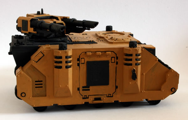 I painted more of the basecoat. For this I used the Foundation Paints from Games Workshop, specifically Tausept Ochre.