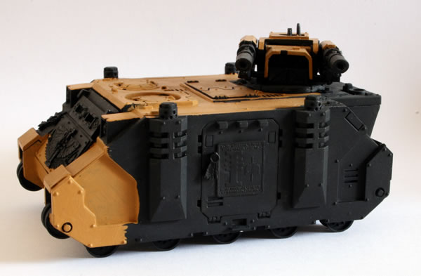 I painted more of the basecoat. For this I used the Foundation Paints from Games Workshop, specifically Tausept Ochre.