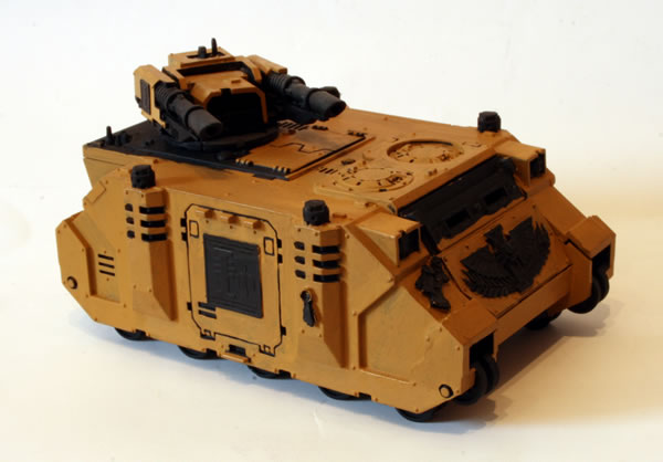 I painted more of the basecoat. For this I used the Foundation Paints from Games Workshop, specifically Tausept Ochre.