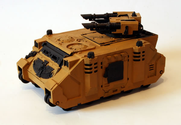 I painted more of the basecoat. For this I used the Foundation Paints from Games Workshop, specifically Tausept Ochre.