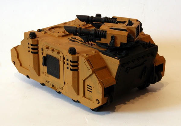 I painted more of the basecoat. For this I used the Foundation Paints from Games Workshop, specifically Tausept Ochre.
